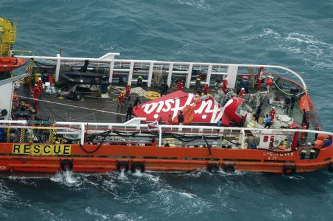The tail of AirAsia QZ8501 passenger plane is seen on the deck of the rescue ship Crest Onyx after it was lifted from the sea bed, south of Pangkalan Bun, Central Kalimantan, January 10, 2015. PHOTO BY REUTERS/Suharso