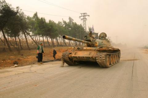A tank for rebel fighters drives in Dahiyat al-Assad west Aleppo city, Syria, October 28, 2016. PHOTO BY REUTERS/Ammar Abdullah