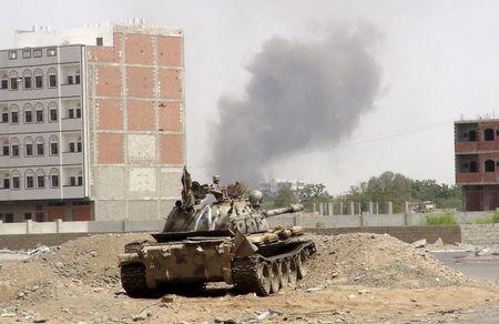 Smoke billows from the site of a Saudi-led air strike on a Houthi position in the outskirts of Yemen's southern port city of Aden, June 15, 2015. PHOTO BY REUTERS/Stringer