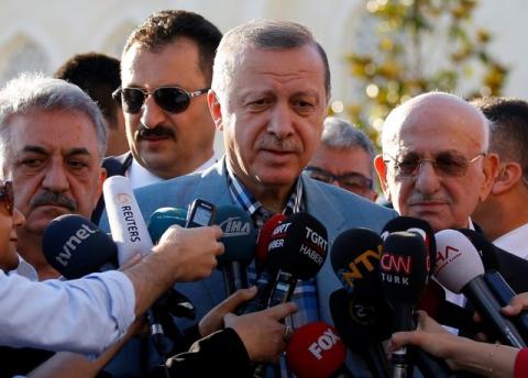 Turkey's President Tayyip Erdogan talks to media after the Eid al-Fitr prayers in Istanbul, Turkey, June 25, 2017. PHOTO BY REUTERS/Murad Sezer