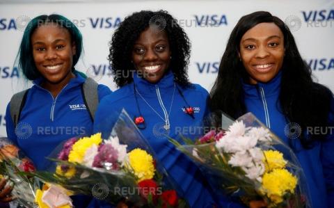 Nigerian Women's Bobsled Team Ngozi Onwumere, Akuoma Omeoga and Seun Adigun pose with flowers upon their arrival in Lagos, Nigeria, as part of preparations ahead of the 2018 Pyeongchang Winter Olympic Games, February 1, 2018. PHOTO BY REUTERS/Afolabi Sotunde