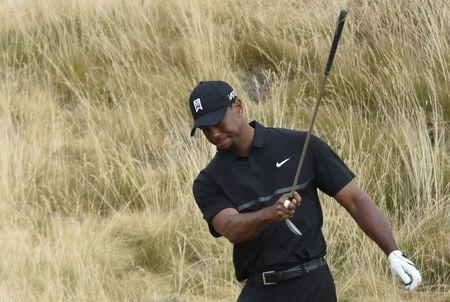 Tiger Woods reacts after attempting to chip onto the 11th green in the first round of the 2015 U.S. Open golf tournament at Chambers Bay. PHOTO BY USA TODAY Sports/Michael Madrid