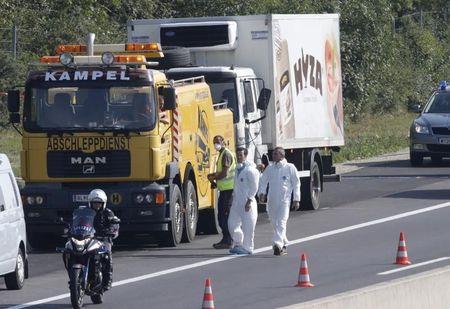 A truck in which migrants were found dead, is prepared to be towed away on a motorway near Parndorf, Austria, August 27, 2015. PHOTO BY REUTERS/Heinz-Peter Bader
