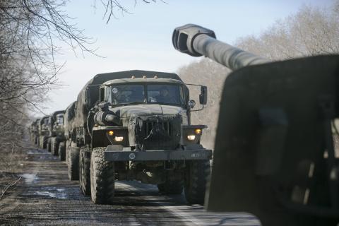 Trucks of the separatist self-proclaimed Donetsk People's Republic army towing mobile artillery cannons, are seen as they pull back from Donetsk, February 24, 2015. PHOTO BY REUTERS/Baz Ratner