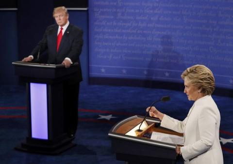 Republican U.S. presidential nominee Donald Trump listens as Democratic U.S. presidential nominee Hillary Clinton speaks during their third and final 2016 presidential campaign debate at UNLV in Las Vegas, Nevada, U.S., October 19, 2016. PHOTO BY REUTERS/Mark Ralston