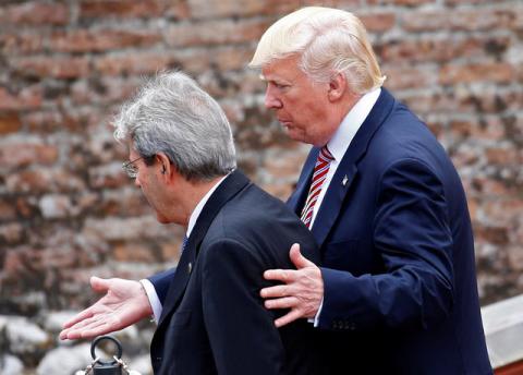 Italian Prime Minister Paolo Gentiloni and U.S. President Donald Trump talk as he arrives at the G7 summit in Taormina, Sicily Italy, May 26, 2017. PHOTO BY REUTERS/Tony Gentile