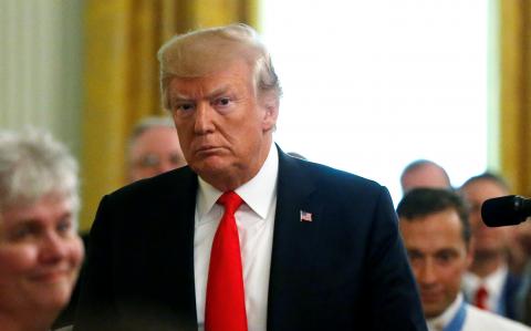 U.S. President Donald Trump departs after awarding a Medal of Honor posthumously to Air Force Technical Sergeant John A. Chapman in the East Room at the White House in Washington, U.S., August 22, 2018. PHOTO BY REUTERS/Leah Millis