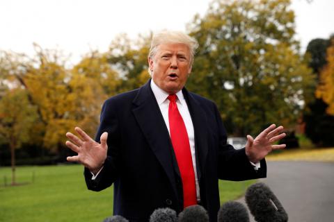 U.S. President Donald Trump speaks to reporters before departing on a campaign trip on the South Lawn of the White House in Washington, U.S., November 2, 2018. PHOTO BY REUTERS/Kevin Lamarque