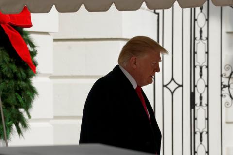 U.S. President Donald Trump walks out from the White House in Washington before his departure for the annual Army-Navy college football game in Philadelphia, U.S., December 8, 2018. PHOTO BY REUTERS/Yuri Gripas