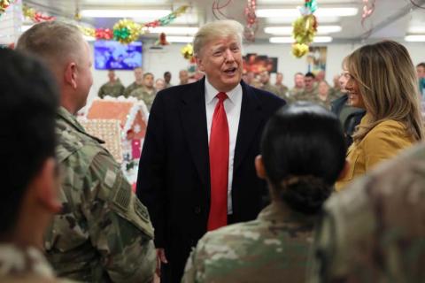 U.S. President Donald Trump and First Lady Melania Trump greet military personnel at the dining facility during an unannounced visit to Al Asad Air Base, Iraq, December 26, 2018. PHOTO BY REUTERS/Jonathan Ernst