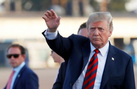 U.S. President Donald Trump gestures as he arrives at Helsinki-Vantaa airport in Vantaa, Finland, July 15, 2018. PHOTO BY REUTERS/Leonhard Foeger