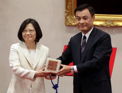 Taiwan's President Tsai Ing-wen (L) receives an official seal after swearing in at the Presidential Office in Taipei, Taiwan, May 20, 2016. PHOTO BY REUTERS/Taipei Photojournalists Association