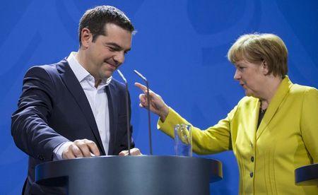 German Chancellor Angela Merkel and Greek Prime Minister Alexis Tsipras leave after addressing a news conference following talks at the Chancellery in Berlin in this March 23, 2015 file photo. PHOTO BY REUTERS/Hannibal Hanschke