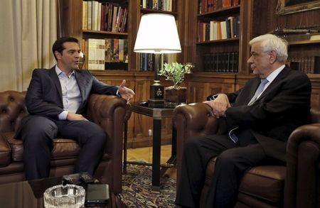 Greek Prime Minister Alexis Tspiras (L) is received by Greece's President Prokopis Pavlopoulios in Athens, Greece, August 20, 2015. PHOTO BY REUTERS/Alkis Konstantinidis