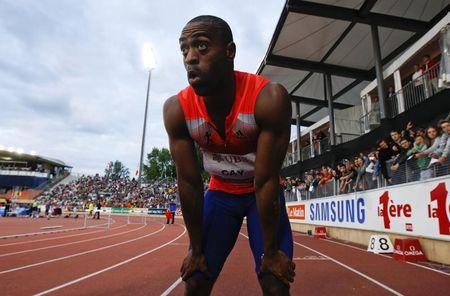 Tyson Gay of the U.S. reacts after winning in the 100m event of the Lausanne Diamond League meeting in Lausanne, July 4, 2013. PHOTO BY REUTERS/Denis Balibouse