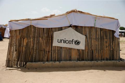 A banner with the UNICEF logo is seen hanging on a makeshift school at an internally displaced persons (IDP) camp on the outskirts of Maiduguri, northeast Nigeria, June 6, 2017. PHOTO BY REUTERS/Akintunde Akinleye