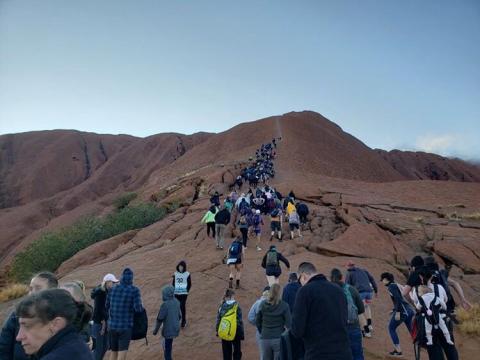 Tourists crowd a trail as they attempt to climb the Uluru, a large sandstone rock formation at Uluru-Kata Tjuta National Park, Northern Territory, Australia September 25, 2019 in this image obtained from social media. PHOTO BY REUTERS/Koki 