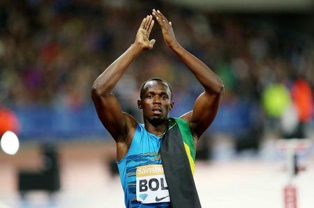 Jamaica's Usain Bolt celebrates after winning the Men's 100m Final Action Images. PHOTO BY REUTERS/Matthew Childs