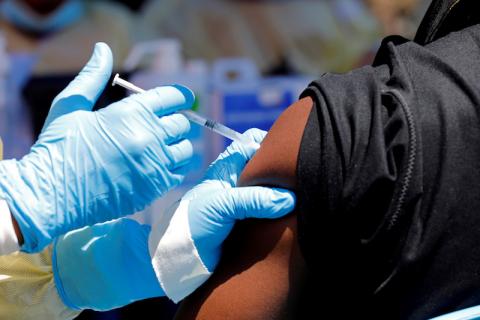 A health worker injects a man with Ebola vaccine in Goma, Democratic Republic of Congo, August 5, 2019.  PHOTO BY REUTERS/Baz Ratner