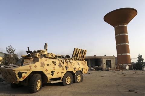 An armoured vehicle is seen after fighting between Libyan special forces and ex-rebel fighters of the Benghazi Shura Council in the eastern city of Benghazi