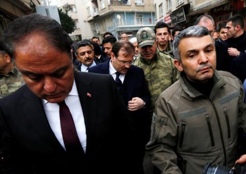 Turkey's Deputy Prime Minister Hakan Cavusoglu and Chief of the General Staff Hulusi Akar visit a neighborhood after a building was hit by rockets fired from Syria's Afrin region, in the border town of Kilis, Turkey, January 27, 2018. PHOTO BY REUTERS/Murad Sezer