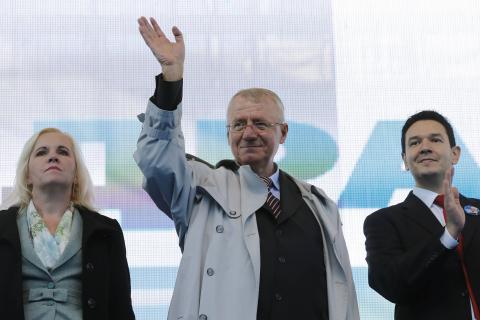 Serbian nationalist leader Vojislav Seselj, surrounded by his party's members, waves during his rally in Belgrade, November 15, 2014. PHOTO BY REUTERS/Marko Djurica