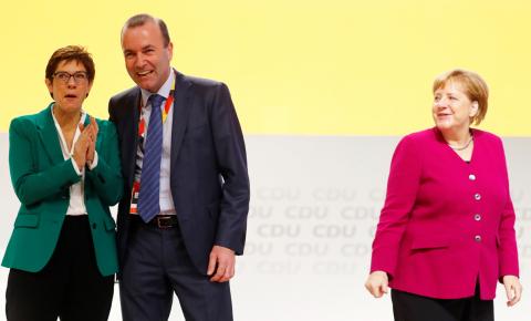 Manfred Weber of the Bavarian sister party CSU (Christian Social Union) appears on stage with newly elected CDU leader Annegret Kramp-Karrenbauer and German Chancellor and former leader of the party Angela Merkel, during the Christian Democratic Union (CDU) party congress in Hamburg, Germany, December 8, 2018. PHOTO BY REUTERS/Kai Pfaffenba