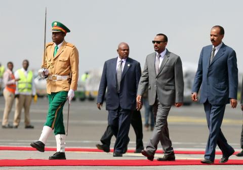 Eritrea's President Isaias Afwerki is welcomed by Ethiopian Prime Minister Abiy Ahmed upon arriving for a three-day visit, at the Bole international airport in Addis Ababa, Ethiopia, July 14, 2018. PHOTO BY REUTERS/Tiksa Negeri
