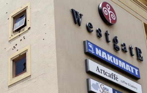 Bullet holes are seen on the Westgate shopping mall that has been left deserted following last year's attack by gunmen in Nairobi, September 18, 2014. PHOTO BY REUTERS/Thomas Mukoya