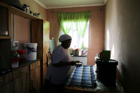 Nyani Moloi prepares food for her granddaughter in her kitchen in the Baken Park township near Bethlehem, South Africa, April 16, 2019. PHOTO BY REUTERS/Sumaya Hisham