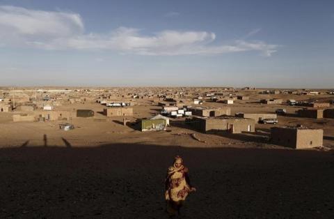 An indigenous Sahrawi woman walks at a refugee camp of Boudjdour in Tindouf, southern Algeria, March 3, 2016. PHOTO BY REUTERS/Zohra Bensemra