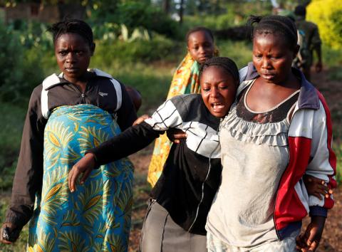 A woman reacts after five other women were killed in Paida, near Beni, North Kivu Province of Democratic Republic of Congo, December 7, 2018. According to a FARDC spokesman, Captain Mac Hazukay, 18 people were killed during the last two days by the Islamist rebel group "Allied Democratic Forces" (ADF) in the village of Paida and the area around the village. PHOTO BY REUTERS/Goran Tomasevic