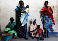 Women hold their babies as they wait for a medical check-up at a United Nations International Children's Fund (UNICEF) supported mobile health clinic in Nimini village, Unity State, South Sudan, February 8, 2017. PHOTO BY REUTERS/Siegfried Modola