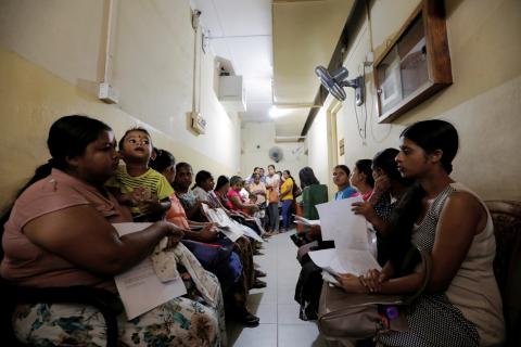Women wait to make statements and complains against Muslim doctor Segu Shihabdeen Mohamed Shafi, who was arrested after accusations of secretly sterilising Buddhist women during their caesarean deliveries at a hospital in Kurunegala, Sri Lanka, May 31, 2019. PHOTO BY REUTERS/Dinuka Liyanawatte