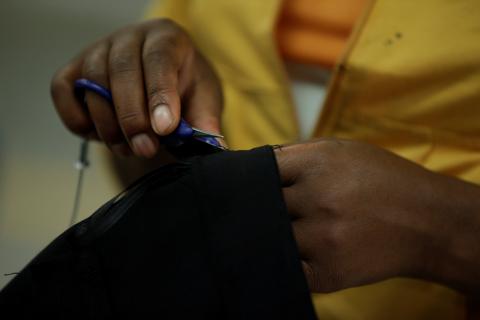A worker removes threads on a garment inside a textile factory in Ethiopia, November 17, 2017. PHOTO BY REUTERS/Tiksa Negeri