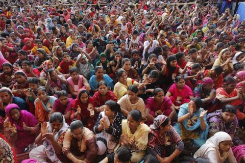 Garment workers listen to speakers during a rally demanding an increase to their minimum wage in Dhaka, September 21, 2013. PHOTO BY REUTERS/Andrew Biraj
