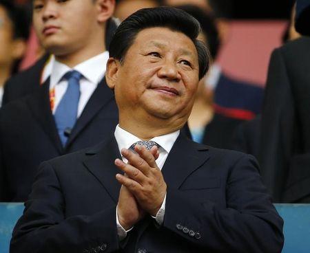 Chinese President Xi Jinping applauds during the opening ceremony of the 15th IAAF World Championships at the National Stadium in Beijing, China, August 22, 2015. PHOTO BY REUTERS/Damir Sagolj