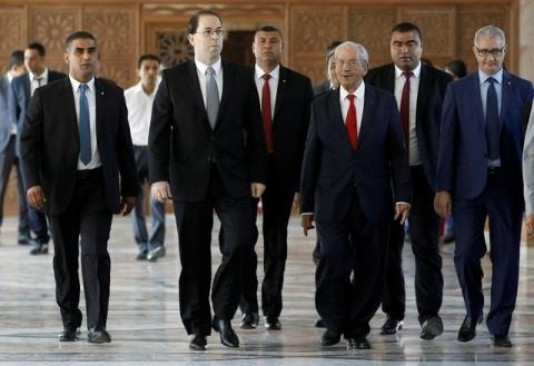 Tunisia's Prime Minister designate Youssef Chahed (front 2nd L) arrives to deliver a speech at the Assembly of People's Representatives in Tunis, Tunisia August 26, 2016. PHOTO BY REUTERS/Zoubeir Souissi