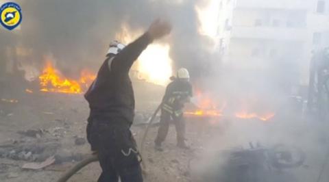 A still image taken from a video uploaded by White Helmets on June 24, 2017, shows civil defence members trying to put out a fire at the site of a car bomb, said to be in the town of al-Dana, in Syria's rebel-held Idlib province. PHOTO BY REUTERS/White Helmets