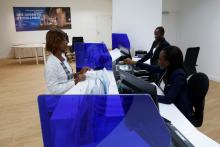 Employees work at the Stanbic Bank in Abidjan, Ivory Coast, April 9, 2018. PHOTO BY REUTERS/Luc Gnago