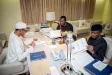 President Muhammadu Buhari, Vice President Yemi Osinbajo and Minister of Budget and National Planning Senator Udoma Udo Udoma read copies of the details of the submitted 2016 national budget by the National Assembly in Abuja, Nigeria April 10, 2016. PHOTO BY REUTERS/Stringer