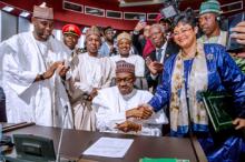 Nigerian President Muhammadu Buhari signs an agreement ahead of the launching of the African Continental Free Trade Area (AfCFTA), during African Union summit in Niamey, Niger, July 7, 2019. PHOTO BY REUTERS/Nigeria Presidency