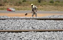 A construction worker works on the new standard gauge railway line near Voi town, Kenya, March 16, 2016. PHOTO BY REUTERS/Goran Tomasevic