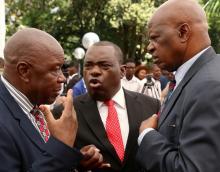 Zimbabwean President Emmerson Mnangagwa's advisor Chris Mutsvangwa talks to Foreign Affairs minister Sibusiso Moyo and Finance Minister Patrick Chinamasa at State House in Harare, Zimbabwe, December 4, 2017. PHOTO BY REUTERS/Philimon Bulawayo