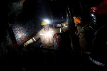 Miners work deep underground at Sibanye Gold's Masimthembe shaft in Westonaria, South Africa, April 3, 2017. PHOTO BY REUTERS/Mike Hutchings