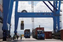 A crane loads shipping containers on a ship in the port of Mombasa, Kenya, October 23, 2019. PHOTO BY REUTERS/Baz Ratner