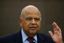 South African Finance Minister Pravin Gordhan reacts during a media briefing in Sandton near Johannesburg, South Africa, March 14, 2016. PHOTO BY REUTERS/Siphiwe Sibeko