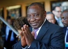Cyril Ramaphosa greets security personal at the World Economic Forum on Africa 2017 meeting in Durban, South Africa, May 5, 2017. PHOTO BY REUTERS/Rogan Ward
