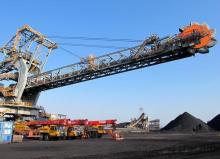 One of the two new rail-mounted stacker reclaimers which scoop up and transfer coal into and out of the yard is seen at Africa's largest coal export facility, the Richards Bay Coal Terminal, Richards Bay harbour, South Africa, June 21, 2018. PHOTO BY REUTERS/Tanisha Heiberg