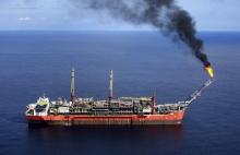 A ship loads crude oil at Bonga off-shore oil field outside Lagos. PHOTO BY REUTERS/Akintunde Akinleye